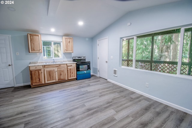 kitchen featuring range with electric cooktop, vaulted ceiling, sink, and light wood-type flooring