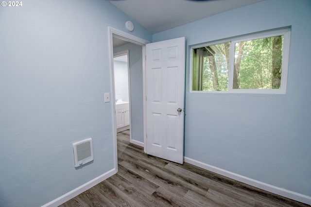 empty room featuring hardwood / wood-style flooring