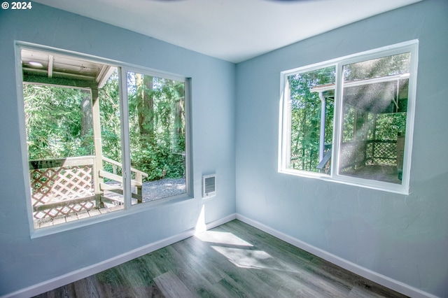 unfurnished room featuring hardwood / wood-style floors