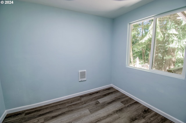 empty room with wood-type flooring