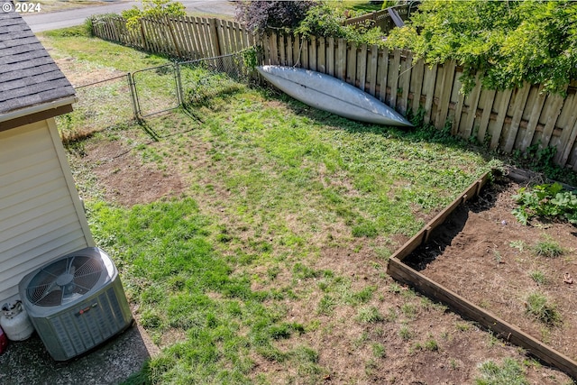 view of yard featuring central AC