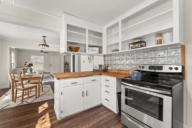 kitchen with pendant lighting, dark hardwood / wood-style floors, stainless steel range with electric cooktop, white cabinets, and butcher block counters