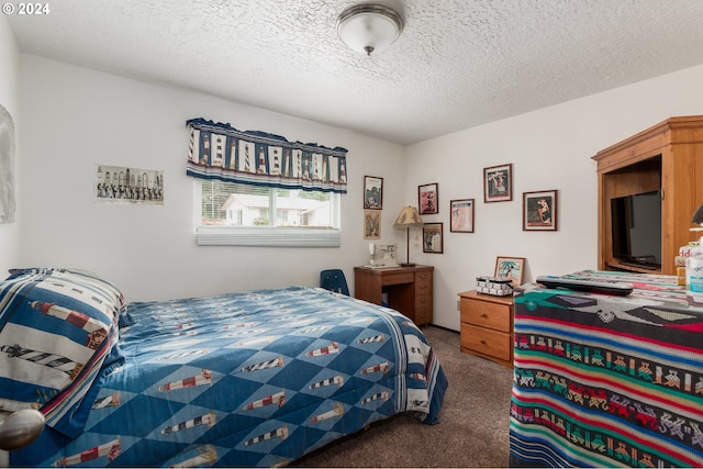 carpeted bedroom with a textured ceiling