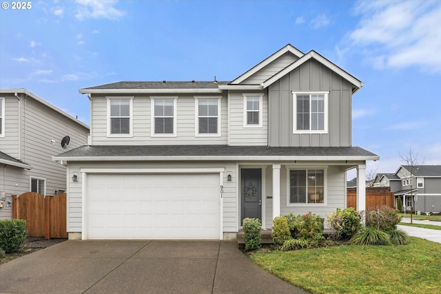 view of front of house with a garage and a front lawn