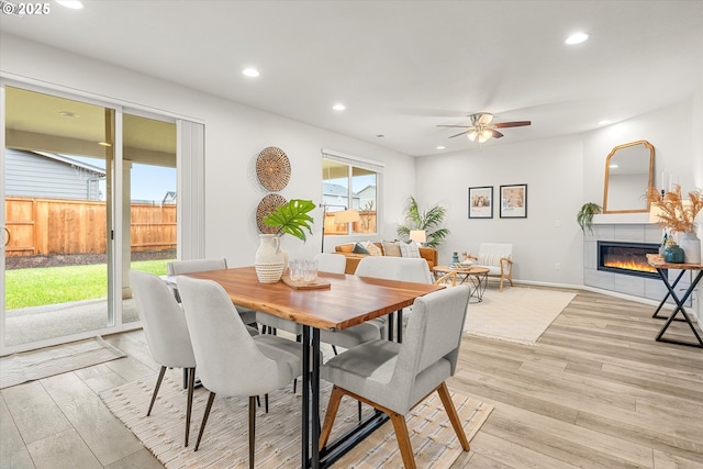 dining room featuring ceiling fan and light hardwood / wood-style floors