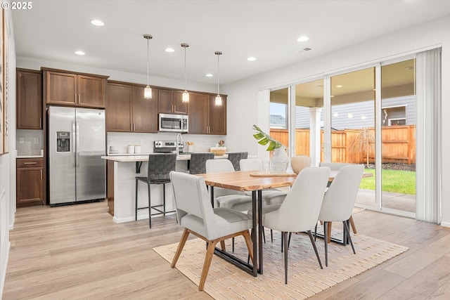 dining room with light hardwood / wood-style floors