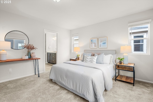 carpeted bedroom with connected bathroom