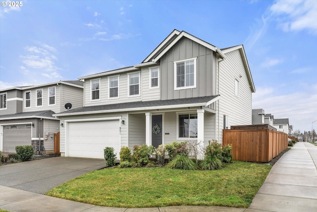 view of front of property featuring a garage and a front yard