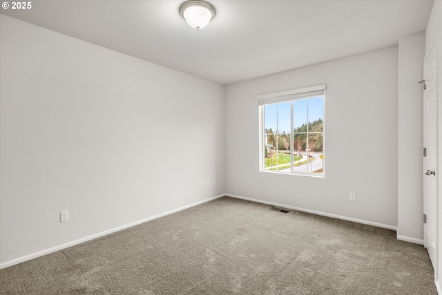 empty room featuring carpet floors