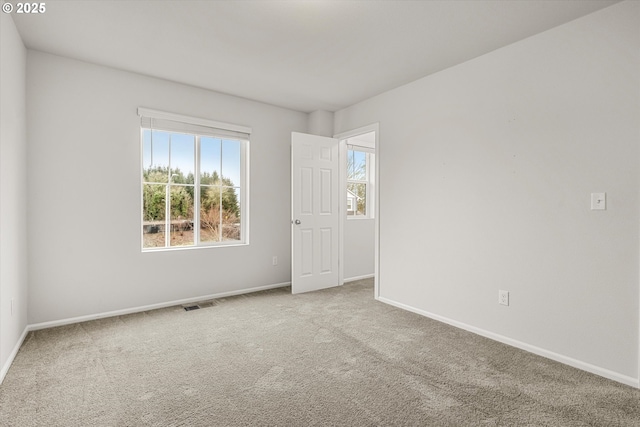 spare room featuring carpet