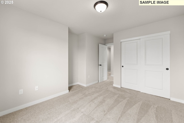 1353 NE Josephine Ct Unit 167, Estacada, OR 97023 - unfurnished bedroom featuring baseboards, a closet, and carpet