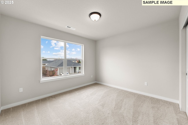 1353 NE Josephine Ct Unit 167, Estacada, OR 97023 - spare room featuring visible vents, carpet floors, and baseboards