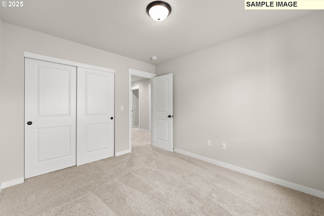 1353 NE Josephine Ct Unit 167, Estacada, OR 97023 - unfurnished bedroom featuring baseboards, a closet, and carpet flooring