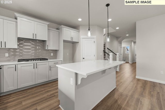 1353 NE Josephine Ct Unit 167, Estacada, OR 97023 - kitchen with dark wood-style flooring, decorative backsplash, stainless steel gas cooktop, and recessed lighting