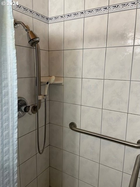 bathroom with a shower with shower curtain