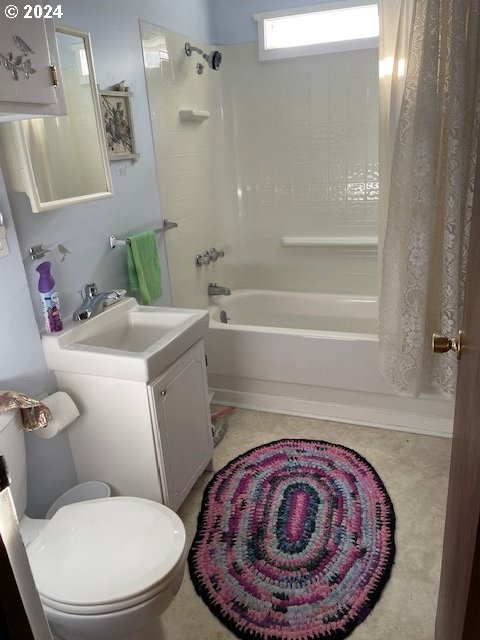 full bathroom with tile patterned flooring, vanity, toilet, and shower / bath combo with shower curtain