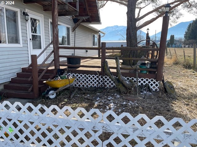 view of yard featuring a deck with mountain view