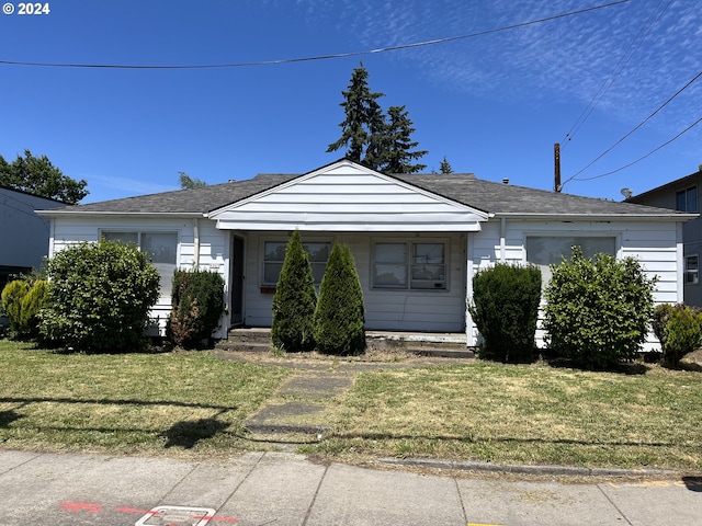 bungalow-style house with a front yard