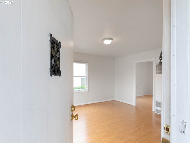 unfurnished room featuring light hardwood / wood-style flooring