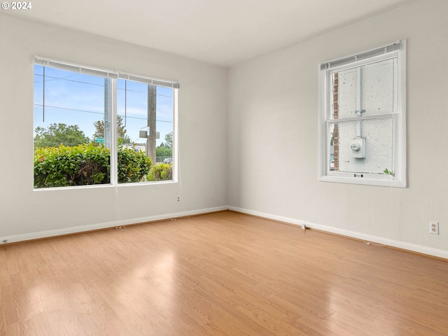 spare room featuring light hardwood / wood-style flooring