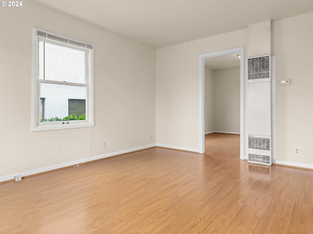 spare room featuring light wood-type flooring