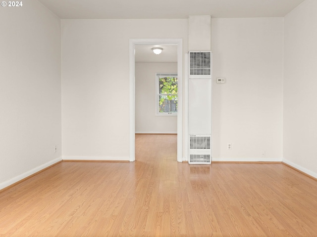 spare room featuring light hardwood / wood-style floors