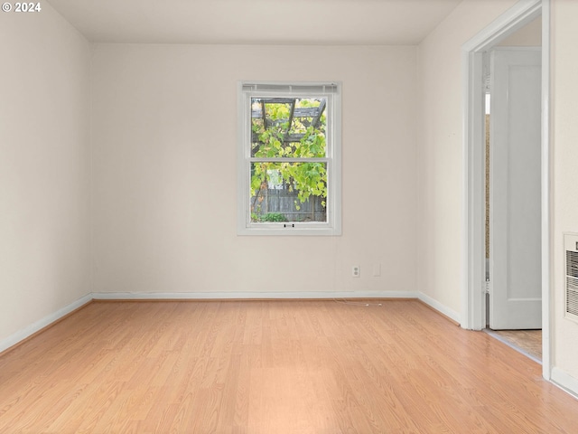 unfurnished room featuring light wood-type flooring