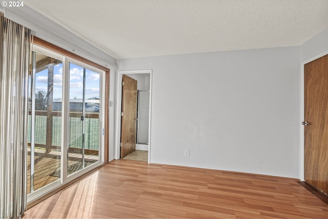 252 State Route 409, Cathlamet, WA 98612 - unfurnished room with light wood-type flooring and a textured ceiling