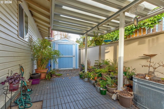 view of patio featuring a storage unit