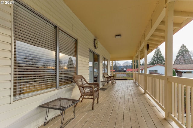 wooden terrace with a porch