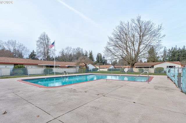 view of pool featuring a patio