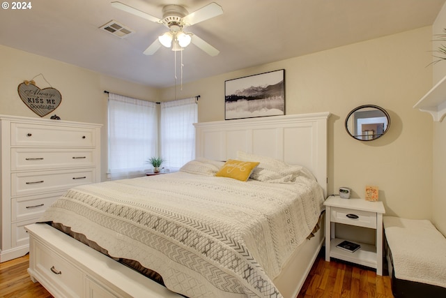 bedroom with ceiling fan and dark hardwood / wood-style flooring