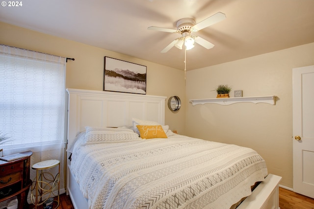 bedroom featuring wood-type flooring and ceiling fan