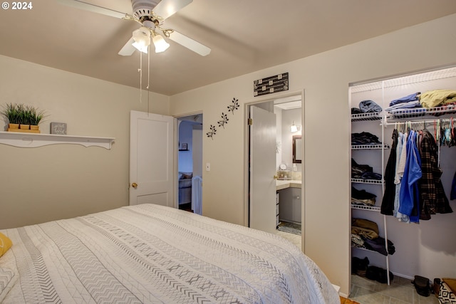 bedroom with ceiling fan, connected bathroom, and a closet