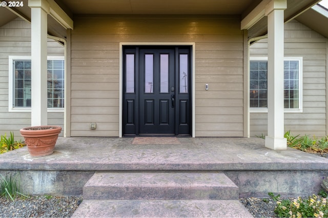 doorway to property with covered porch