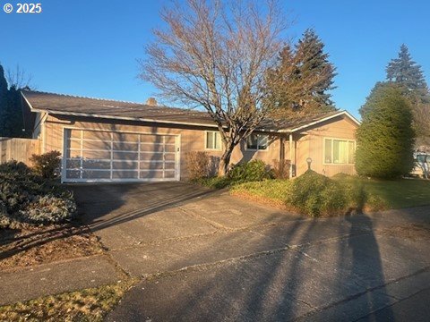 single story home featuring a garage