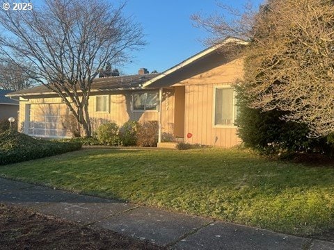 ranch-style home with a front yard