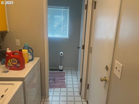 laundry room with independent washer and dryer