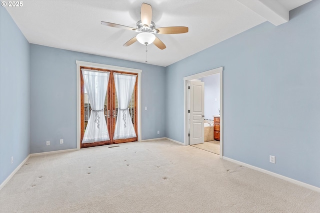 empty room featuring beam ceiling, carpet flooring, ceiling fan, and baseboards