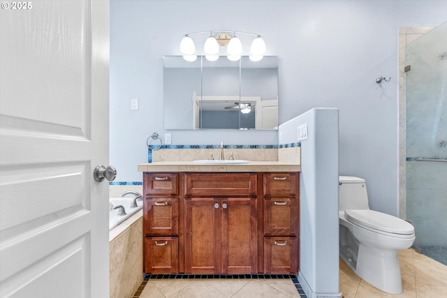 full bath with a garden tub, toilet, a shower stall, tile patterned flooring, and vanity