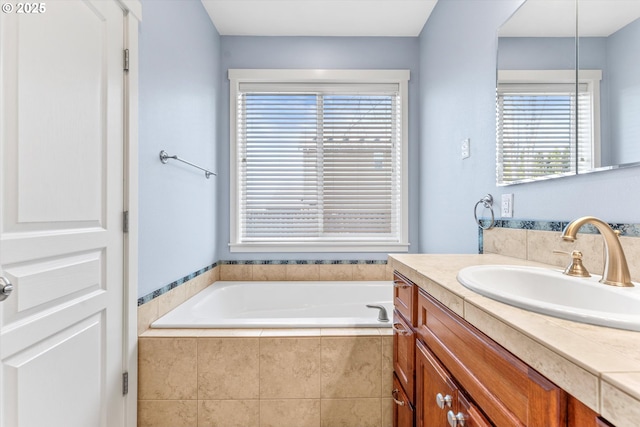 bathroom featuring a bath and vanity