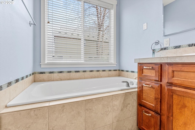 bathroom featuring vanity and a garden tub