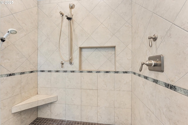 bathroom featuring tiled shower