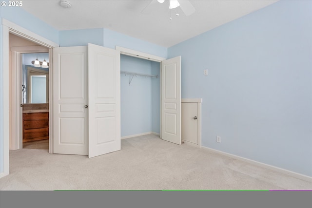 unfurnished bedroom featuring a closet, carpet flooring, ceiling fan, and baseboards