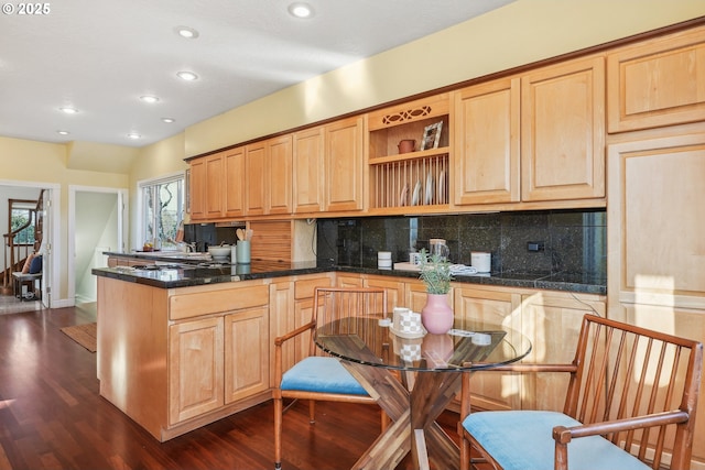 kitchen with light brown cabinetry, backsplash, and dark hardwood / wood-style floors