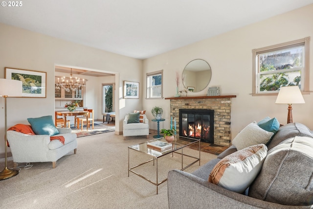 living room featuring a brick fireplace and a chandelier