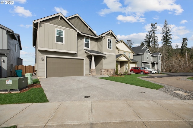 craftsman-style house featuring a garage and a front lawn