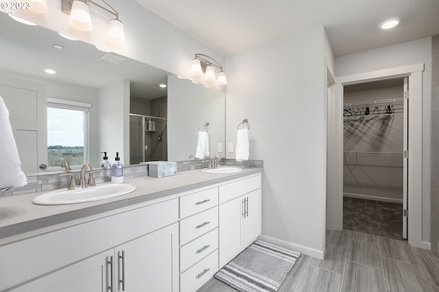 bathroom with vanity and an enclosed shower