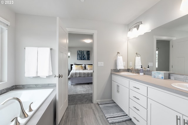 bathroom featuring vanity and a bathing tub