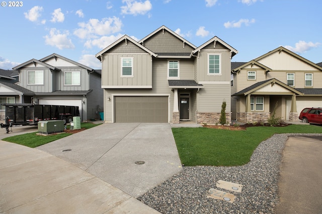 view of front of house with a garage and a front yard